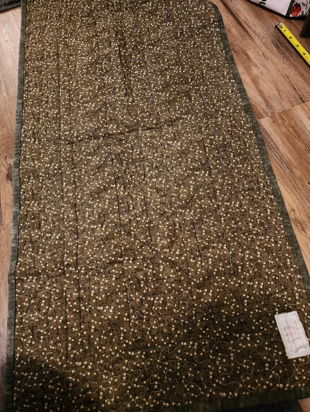Green, brown and beige quilted table topper